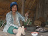Ann man preparing dinner, Num Lin village